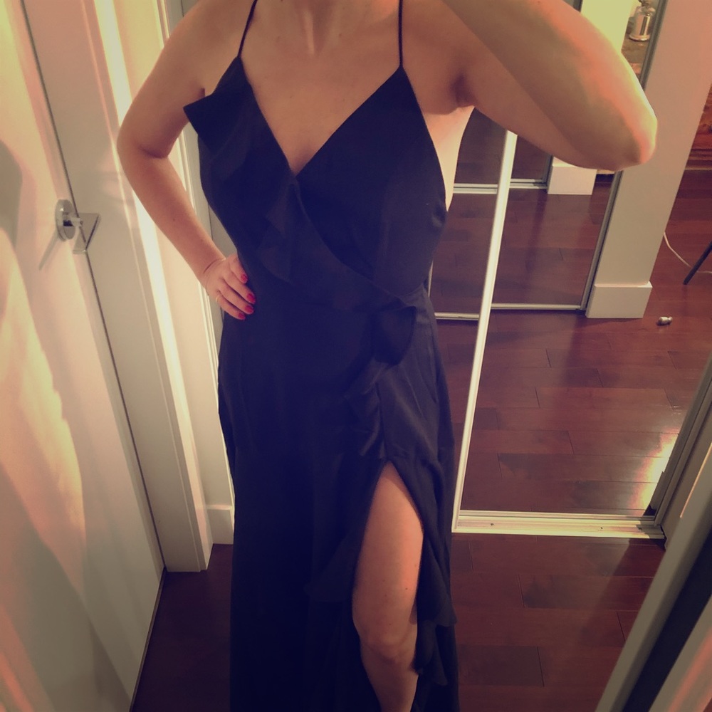 NWOT long black dress with ruffle and leg slit